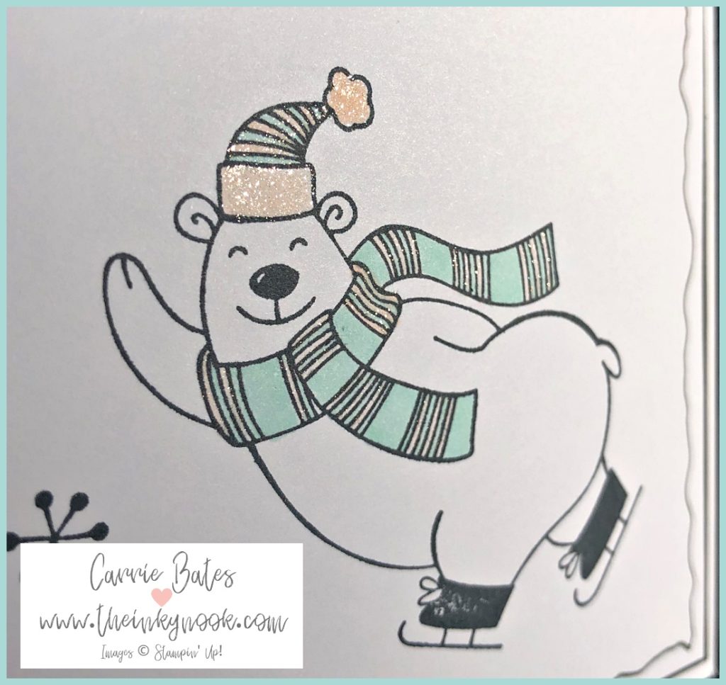 Polar bear ice skating Christmas card - a polar bear wearing a bobble hat and scarf coloured in light pink and blue. Handmade warm and toasty Christmas cards