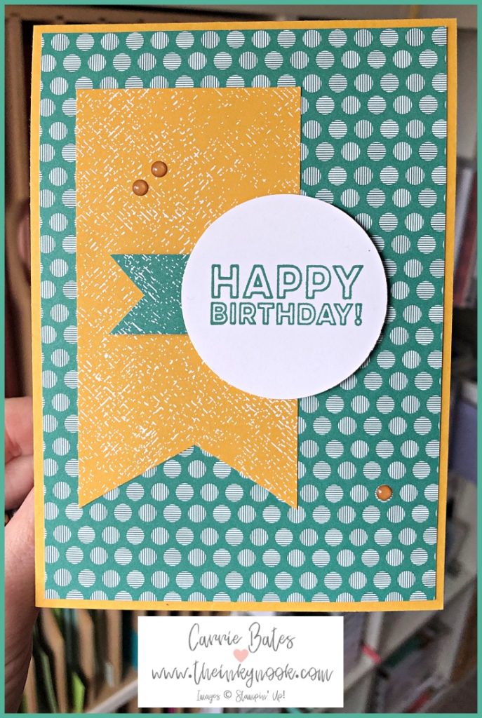 Simple birthday card which is Just Jade green and Bumblebee yellow in colour.  The card base is Bumblebee Yellow.  The card has a  designer series paper layer which is has a green base filled with white dots.  This is topped with a narrow rectangle in yellow designer series paper placed on the left hand side.   This is topped with a green banner placed horizontally and topped with a white circle which has the words 'Happy Birthday'  stamped in Just Jade. Then 3 Bumblebee yellow enamel dots are randomly placed on the card.