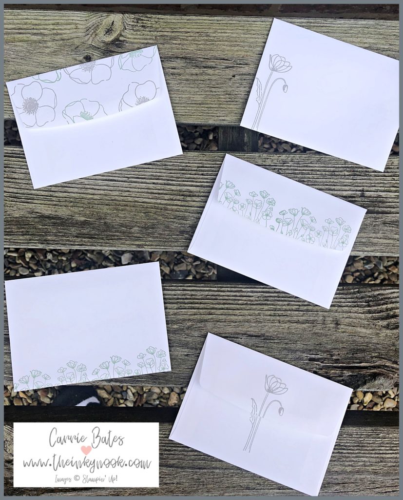 White envelopes stamped with poppies in smoky grey and mint green ink.  Part of a learn how to make a notecard holder tutorial.
