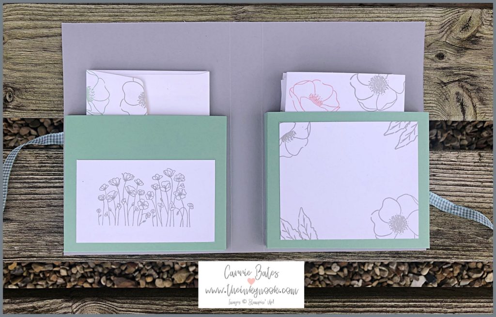 The inside of the notecard holder folded open like a book.  The cover is grey topped with two green pockets to hold the floral decorated notecards and envelopes.  the pockets also have a white layer stamped with grey poppy images.  Learn how to make a notecard holder tutorial.