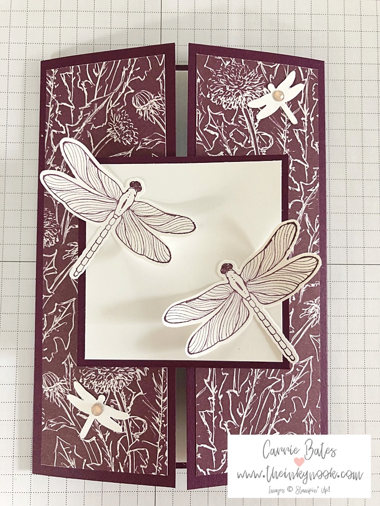 Purple card topped with purple dandelion paper and a sliding topper with dragonflies on top for my parents wedding anniversary card.