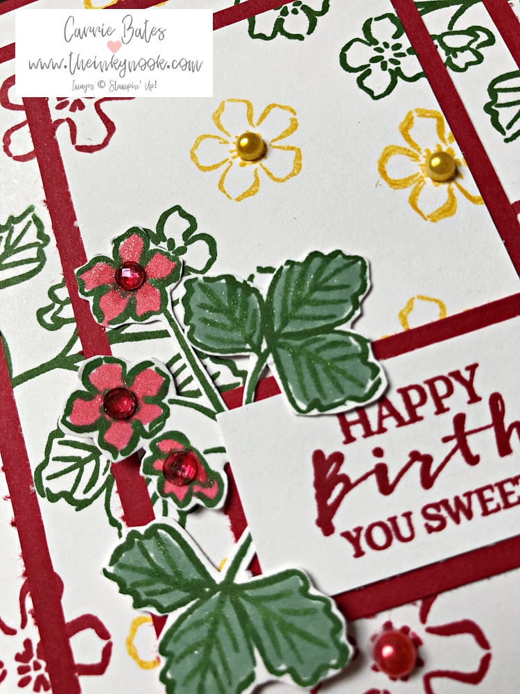 Strawberry pyramid card showing red and white card layers stamped up with wild flowers and strawberry plant branches