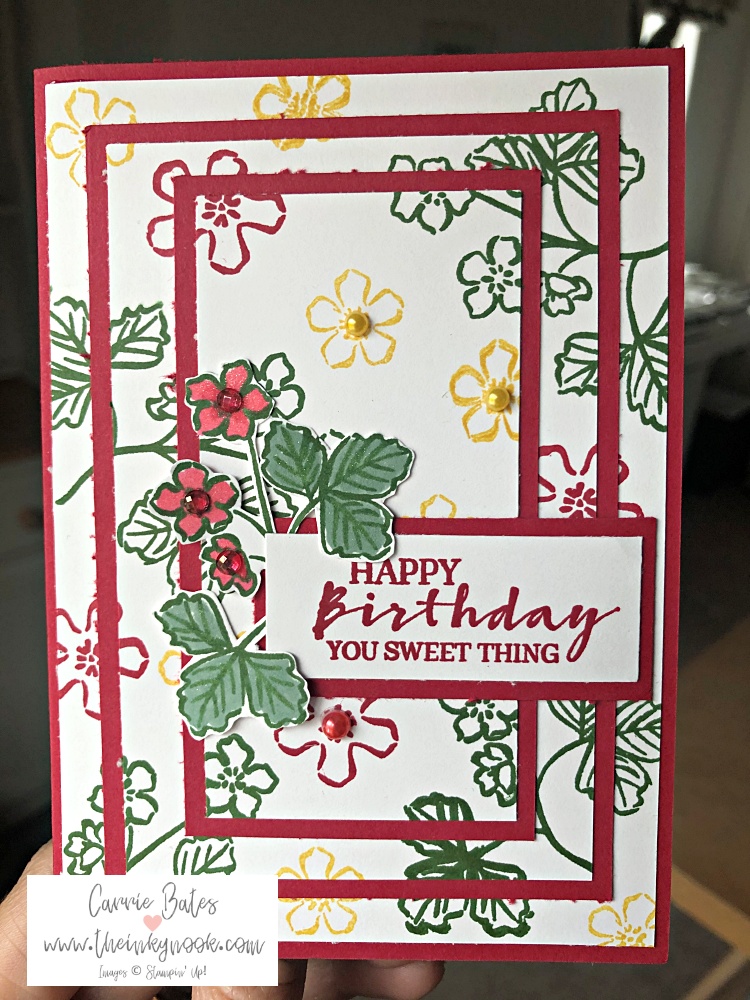 Strawberry pyramid card showing red and white card layers stamped up with wild flowers and strawberry plant branches