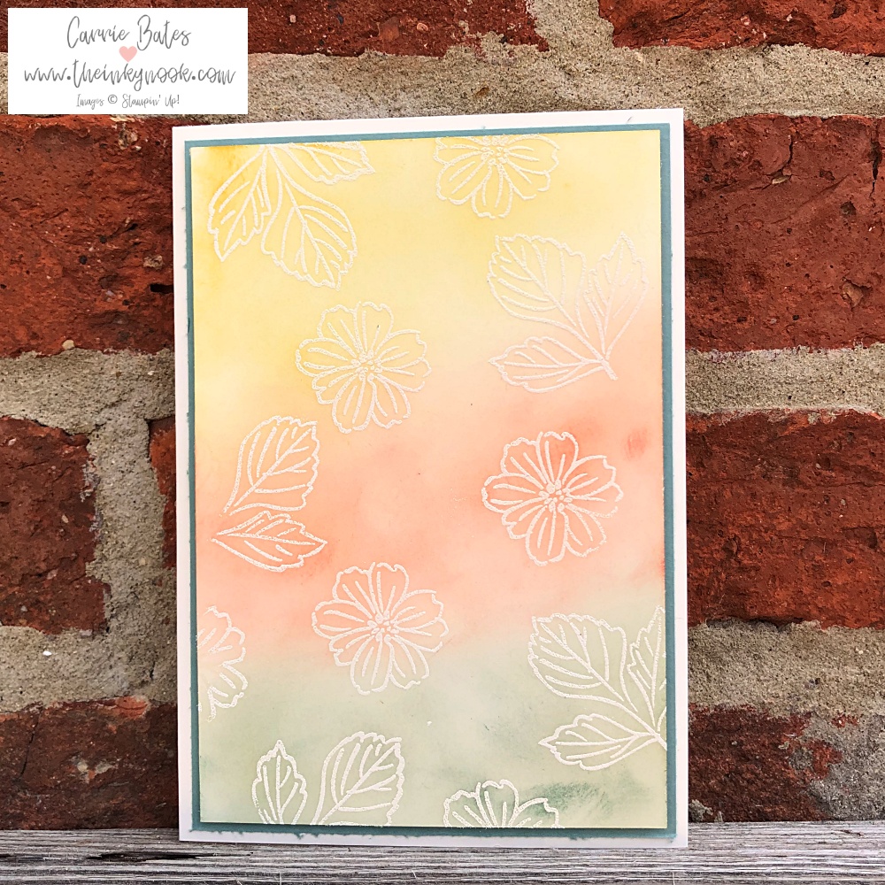 Very vanilla card topped with a green frame and multicoloured card top with embossed flowers and leaves