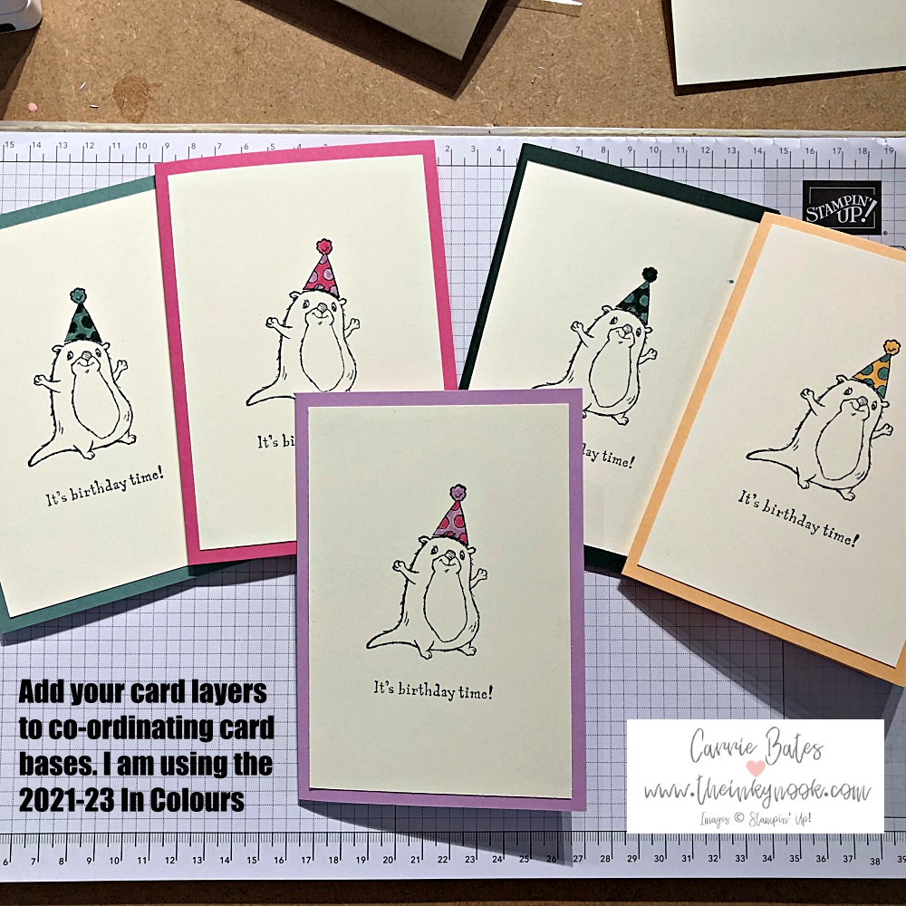 Step by step images showing how to use the Stamparatus  - a stamp positioning tool. Colourful cards stamped with an otter wearing a party hat.