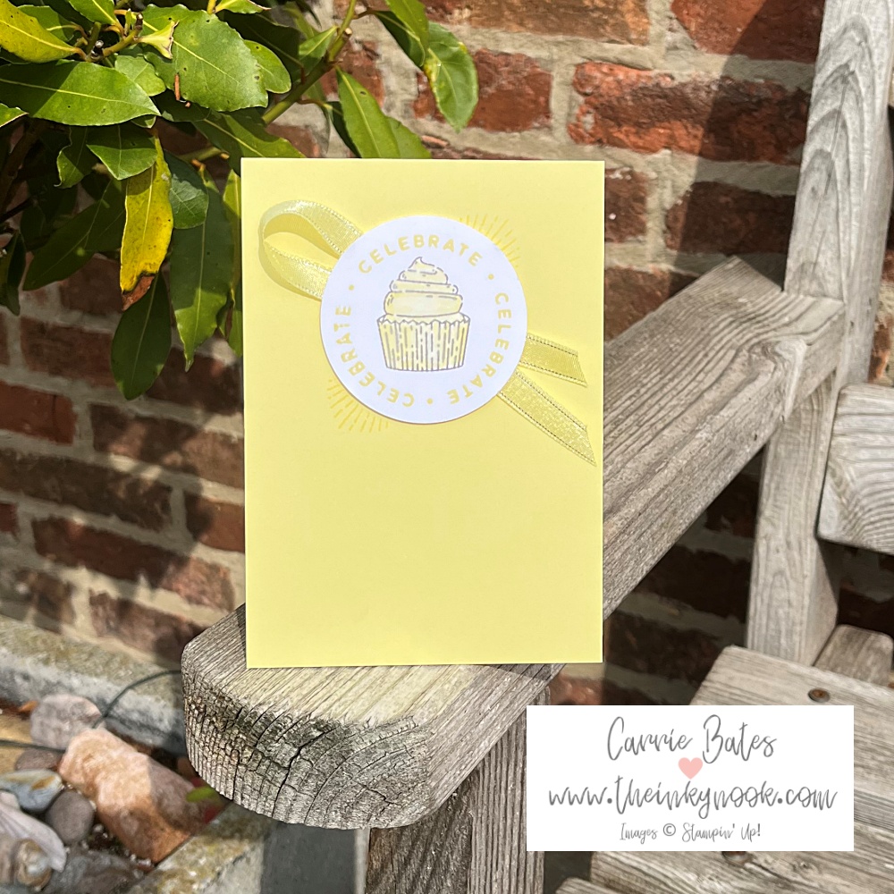 Lemon coloured card topped with a yellow stamped iced cupcake and border in yellow spelling "celebrate". A cute cupcake birthday card idea.