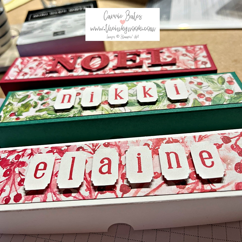 Red, green and white personalised tealight holders with Christmas inspired papers.