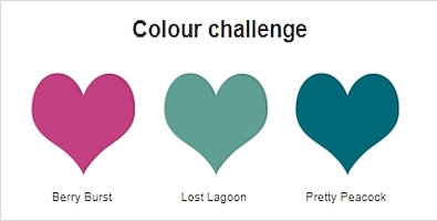 An image showing 3 different colour hearts which are being used to make a quick and easy birthday card. The hearts are a deep pink, a mid blue-green and a dark blue-green