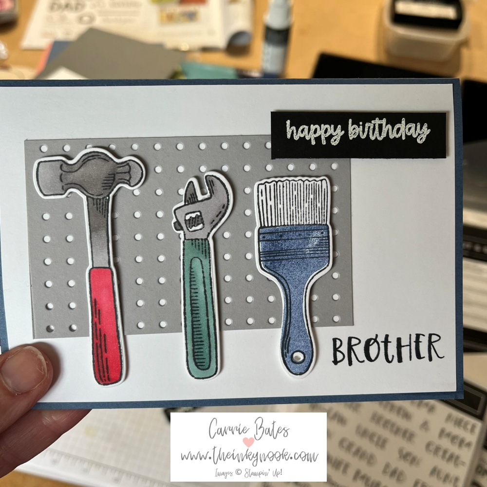 An alternative to my sons card for my brother. A grey card base with a white layer and then a colours hammer, wrench and paintbrush are fixed to a grey metal looking board.