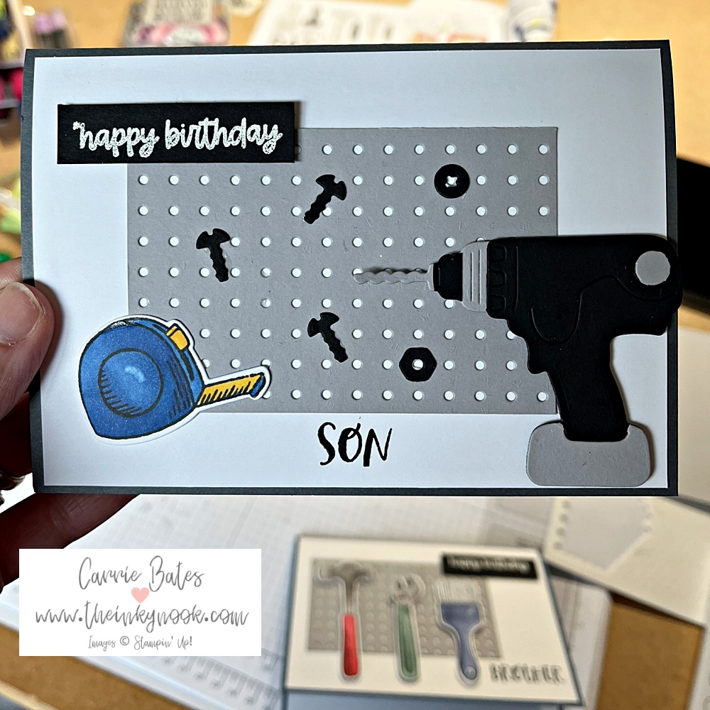 My son's birthday card - a grey card base is topped with a white layer and then a light grey card dotted with holes like a tool rack. This then has a black and grey drill surrounded by black screws and washers with a happy birthday greeting.